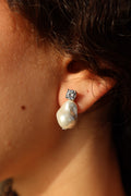 PEARL STUD EARRINGS .