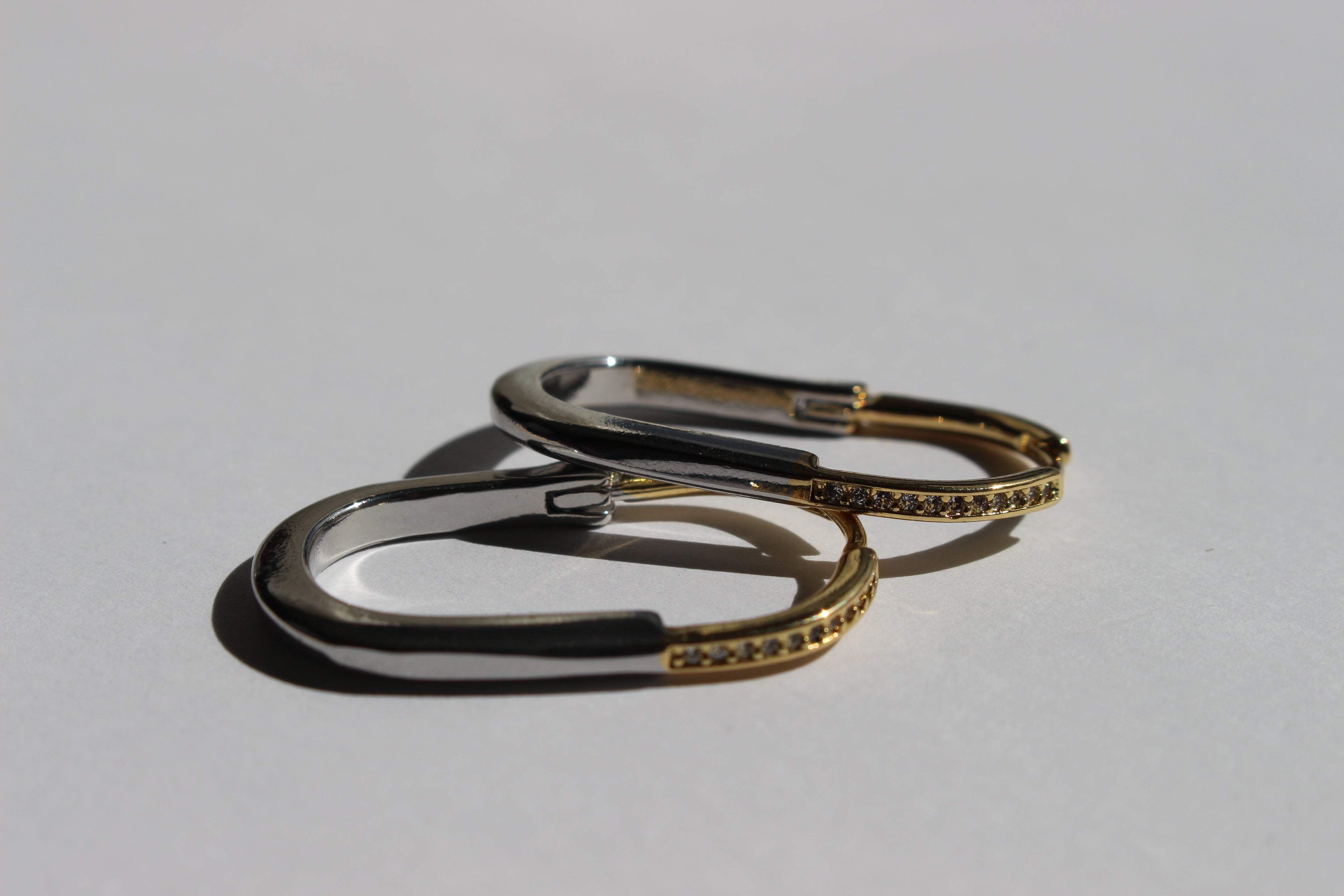 two-toned crystal hoop earrings .