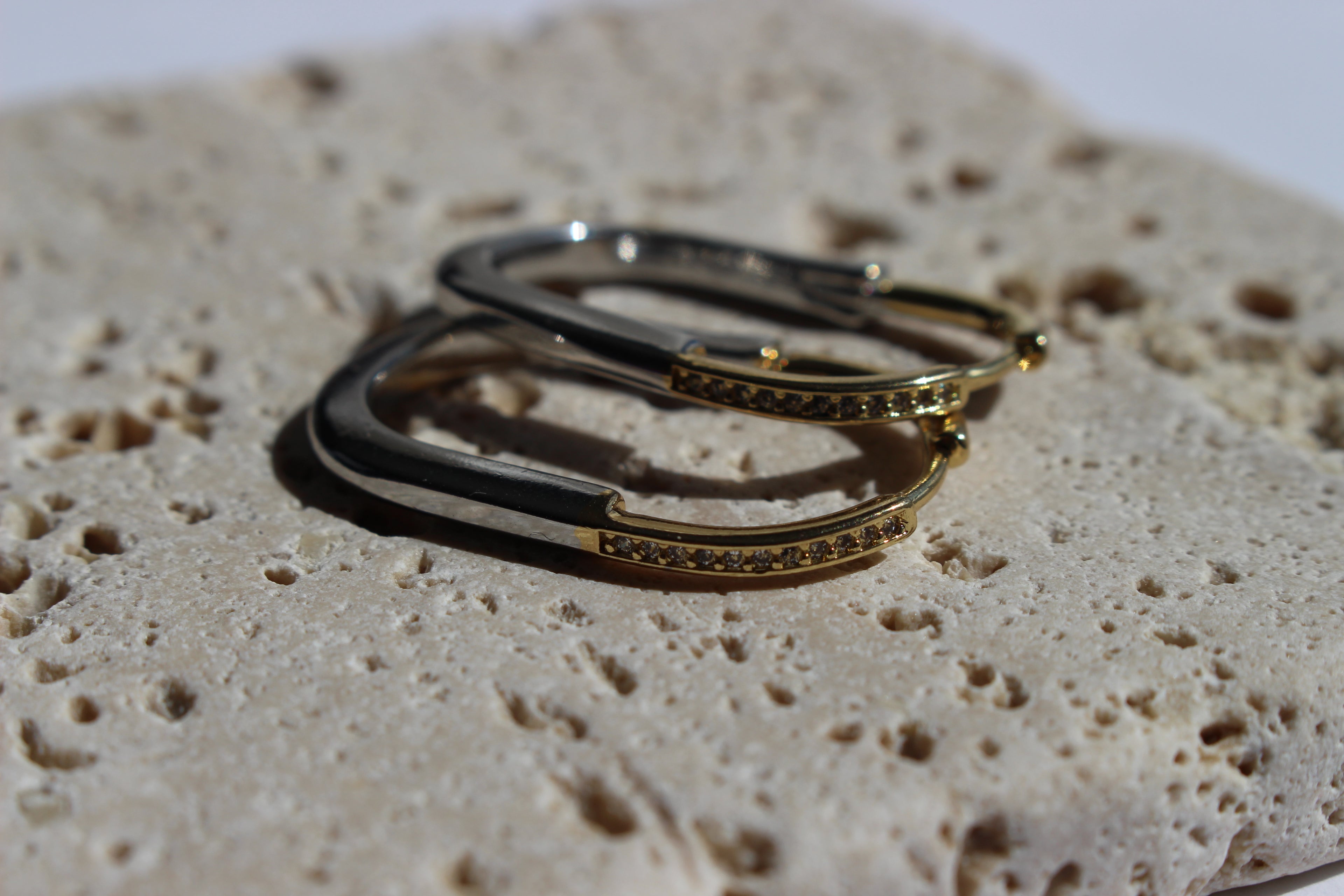 two-toned crystal hoop earrings .