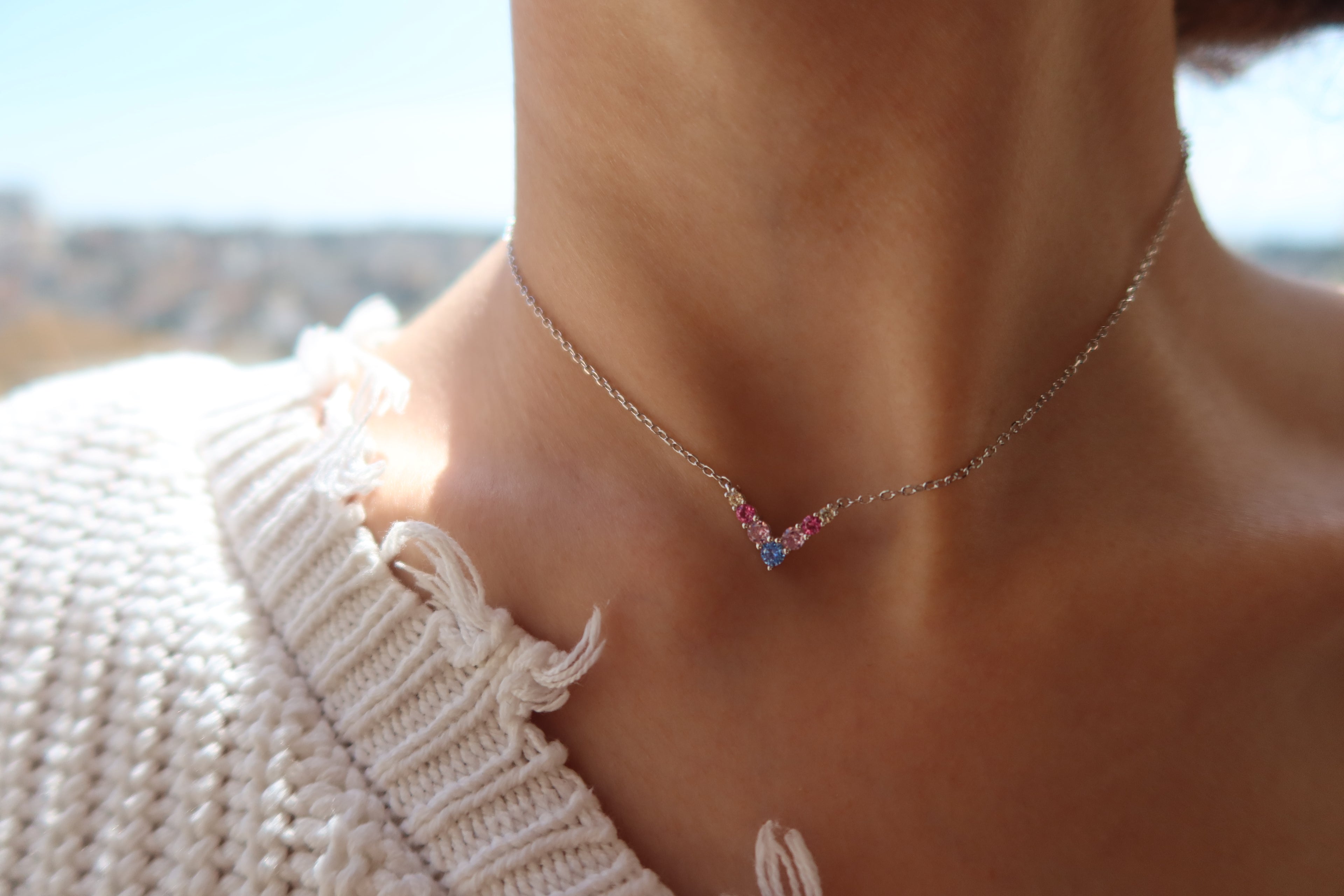 RAINBOW V NECKLACE .