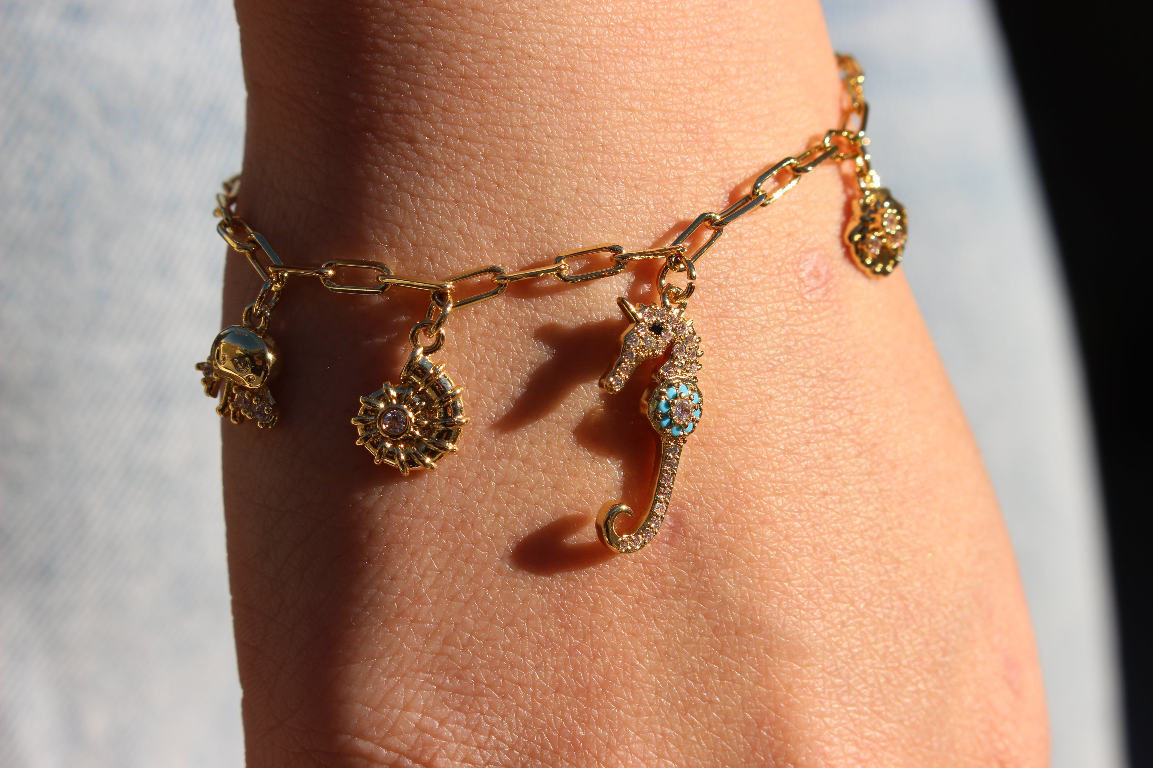 OCEAN CHARM BRACELET .