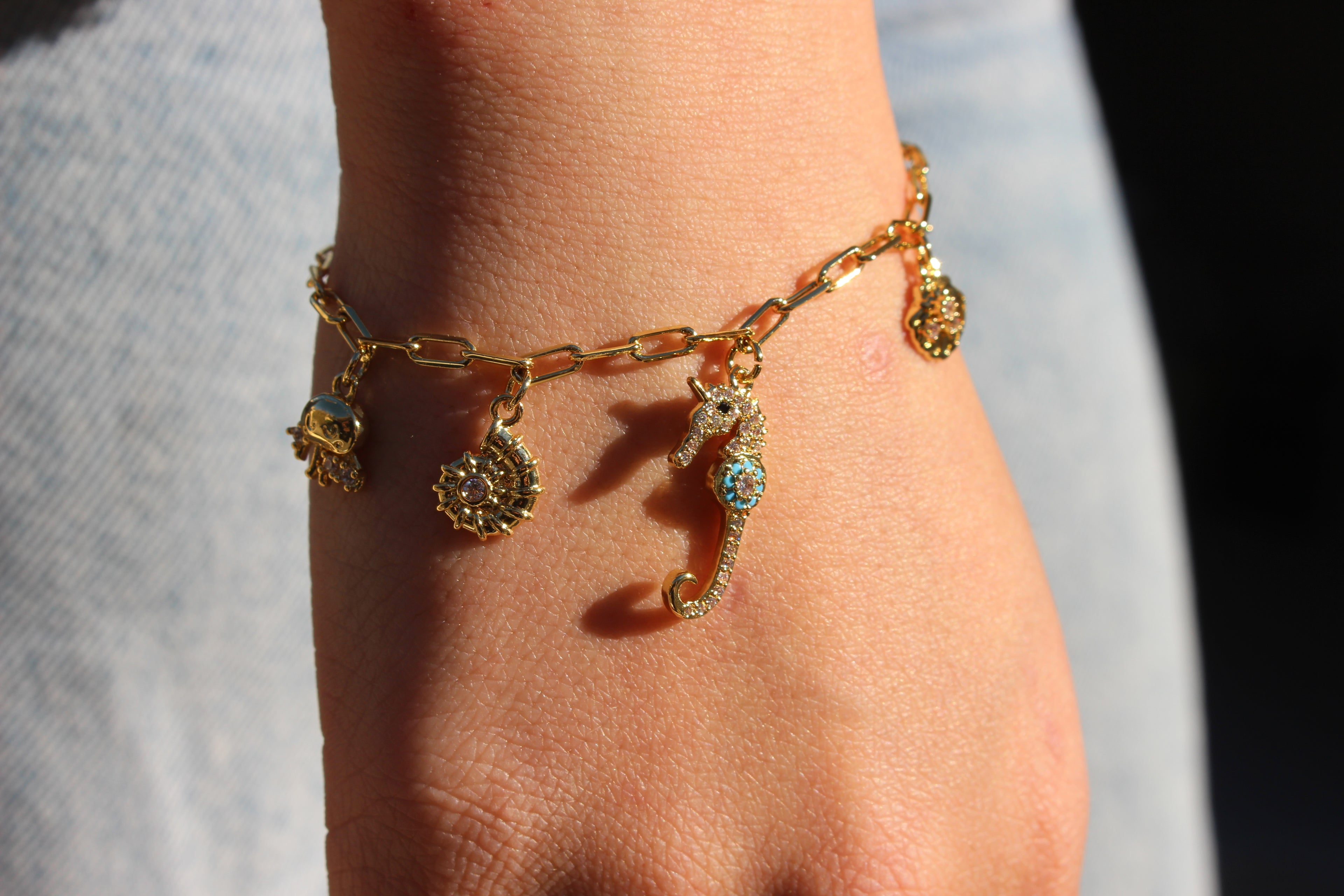 OCEAN CHARM BRACELET .