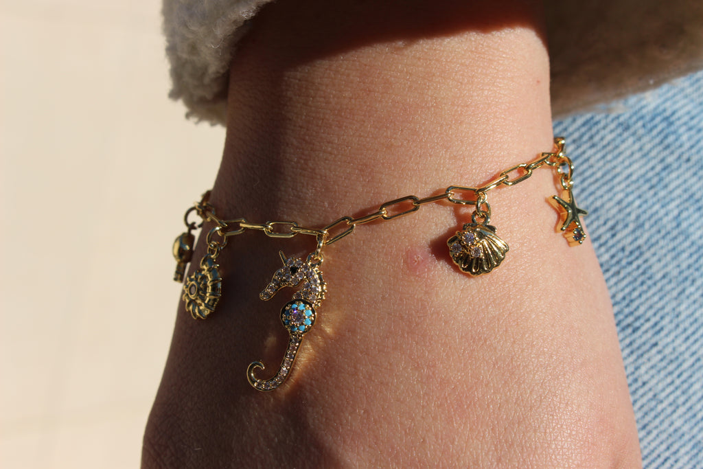 OCEAN CHARM BRACELET .