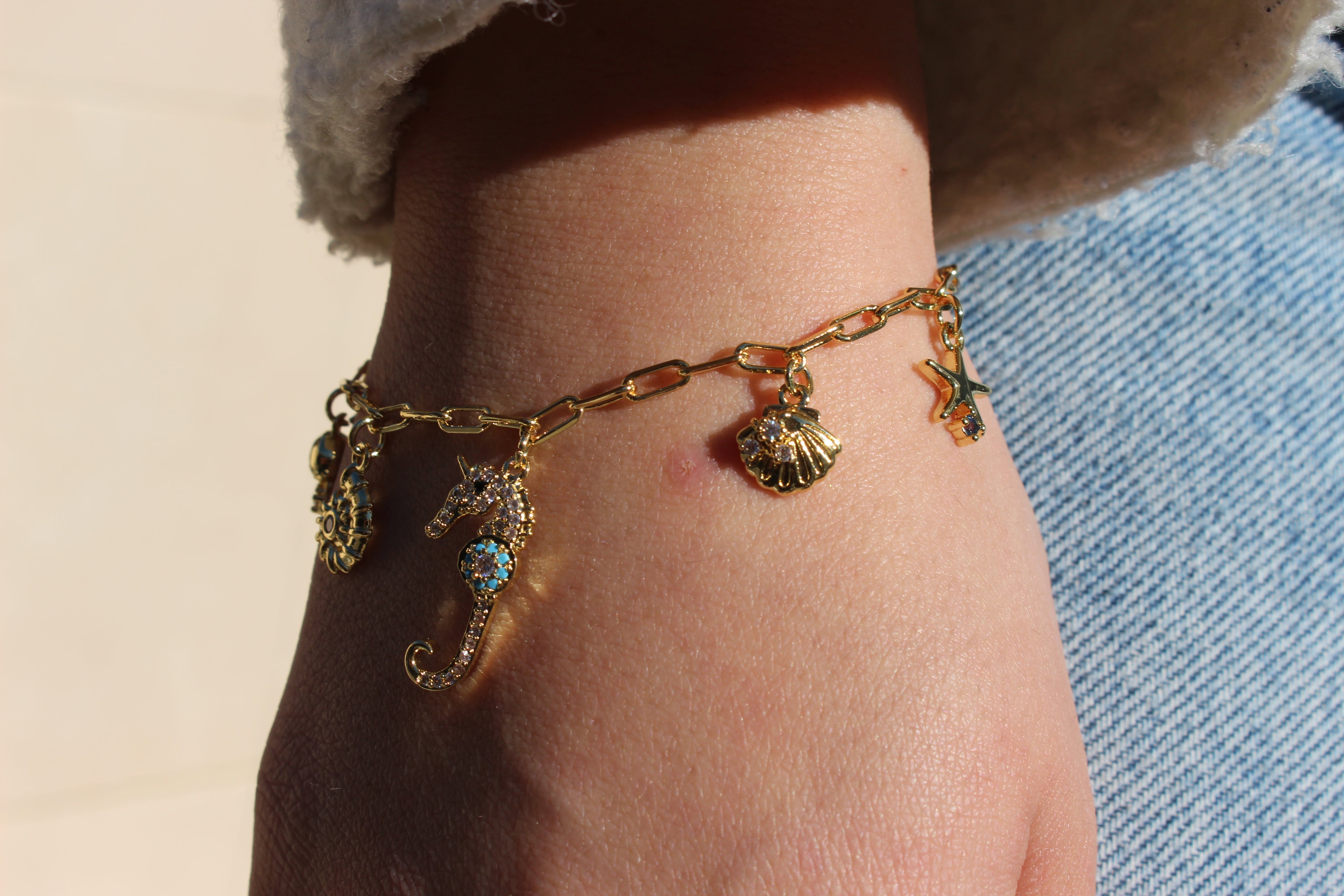 OCEAN CHARM BRACELET .